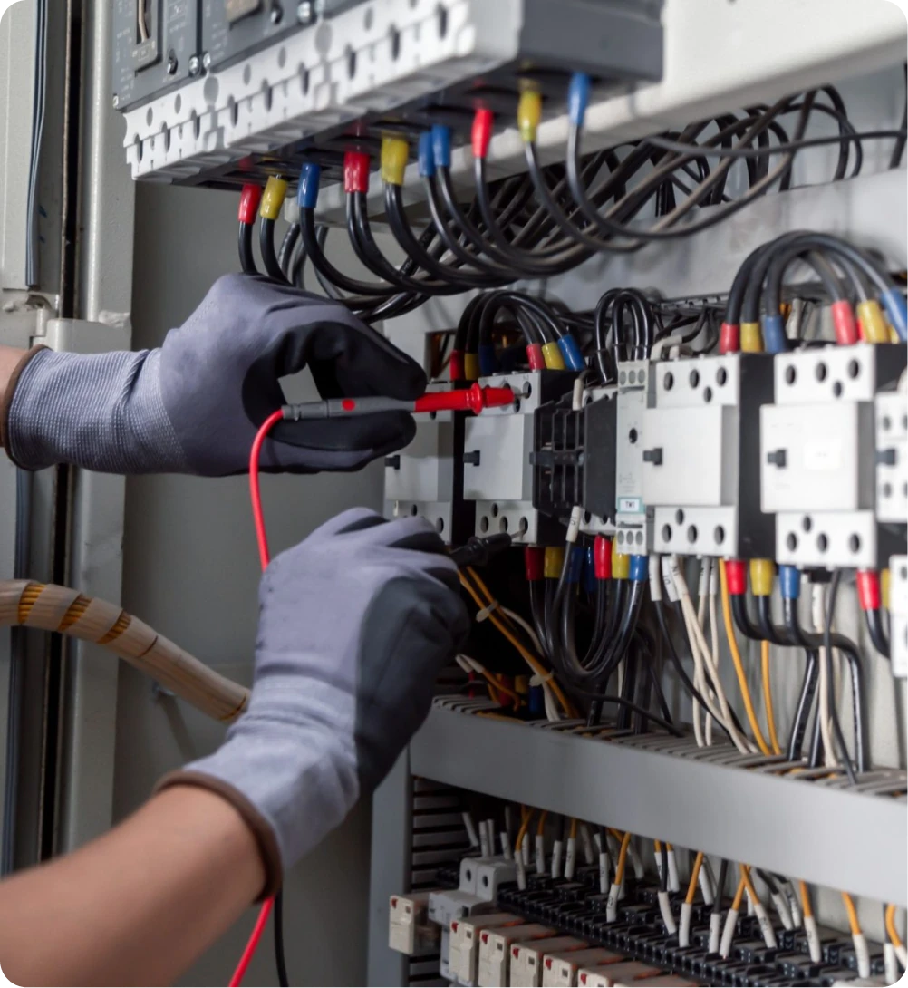 Electrician working on an electrical panel